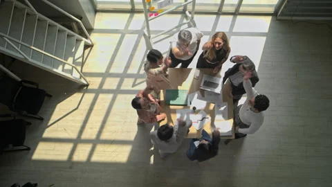 Top view of a multicultural business team stacking hands together 库存影片 339069578