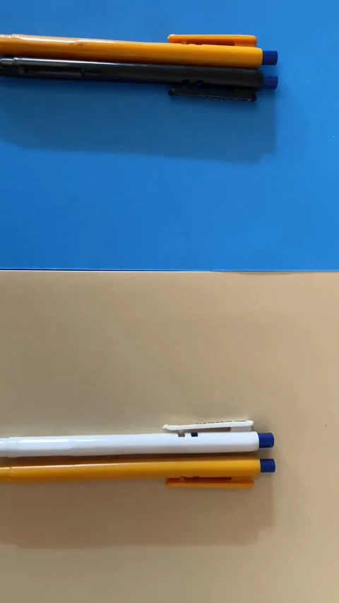 Top View of Multiple Colours Ball pens on Two registers Stock Footage 293948133