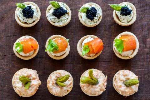 Top view of multiple mini pastry tartlets. Stock Photos
