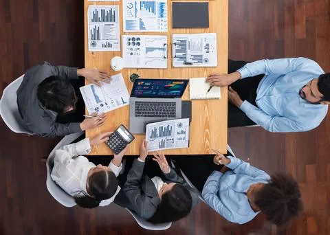Top view multiracial analyst team use BI dashboard for data analysis. Concord Stock Photos