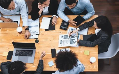 Top view multiracial analyst team use BI dashboard for data analysis. Concord Stock Photos