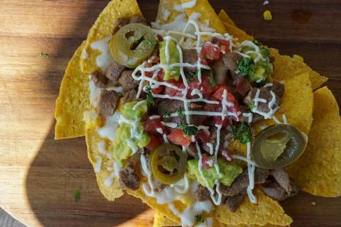 Top view of nachos on the table. Good illustration for meal on vacation. Stock Photos