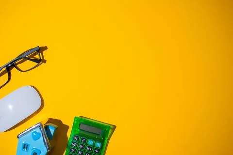 A top view of a neon orange surface with small objects on it at the bottom le Foto stock