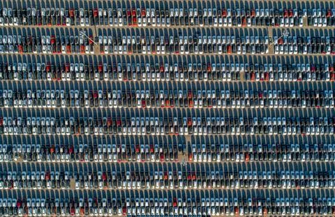 Top view of new cars lined up outside an automobile factory Stock Photos