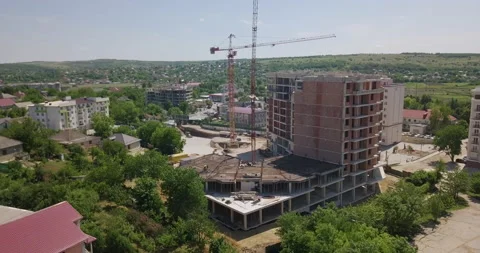 Top view at a new construction development site with tall red tower cranes Stock Footage 202884264