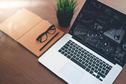 Top view of new modern computer laptop with blank screen and blank book wit.. Stock Photos