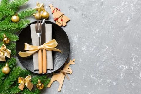 Top view of New Year dinner on festive cement background. Composition of plat Stock Photos