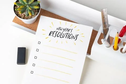 Top view new year's resolutions checklist on white paper note on modern off.. Stock-Fotos