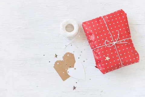 Top view on nice celebration gift with ribbon and tags. Wrapped present Stock Photos