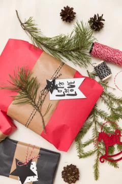 Top view on nicely wrapped Christmas gifts and decorations in red and black Stock Photos