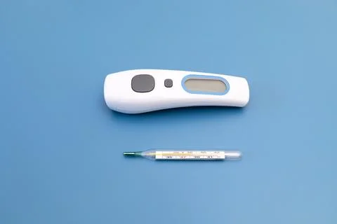 Top View No Touch Thermometer and Glass Oral Mercury Thermometer with Reading Stock Photos