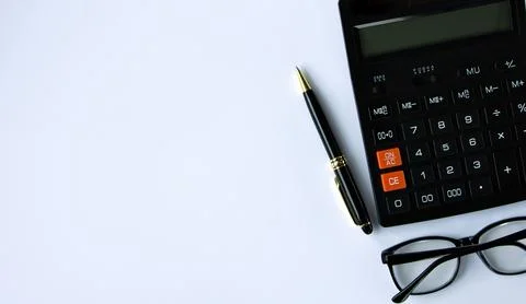 Top view of notebook, calculator, pen and glasses. Place for recording. Banne Stock Photos