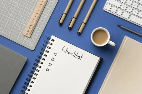 Top view notebook with checklist on desk Stock Photos