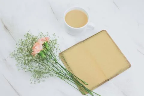 Top view notebook with empty vintage paper sheets ,coffee with milk cup and f Stock-Fotos