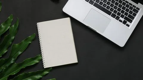 Top View notebook leaf laptop on black background 스톡 사진