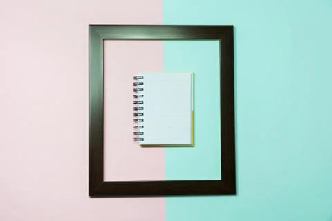 Top view of notebook in middle of frame on colorful background and copy space Stock Photos