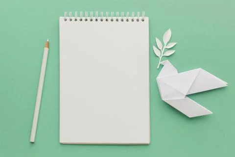 Top view notebook with paper dove pencil. High quality and resolution beautiful Stock Photos