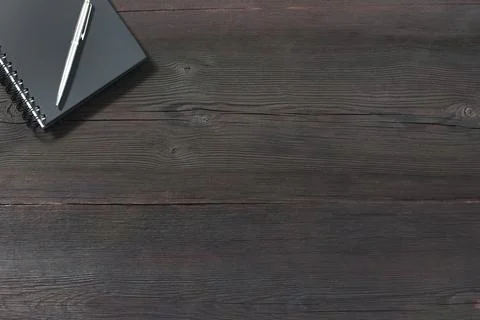 Top View Notebook with pen on old wooden table Stock Photos