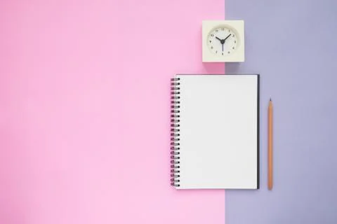 Top view of notebook pencil clock Stock Photos