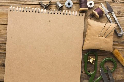 Top view notebook with scissors thread. High quality and resolution beautif.. Stock Photos
