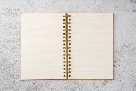 Top view of notebook on stone background Stock Photos