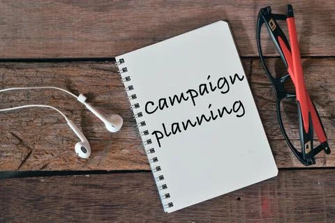 Top view of notebook written with text CAMPAIGN PLANNING. Stock Photos