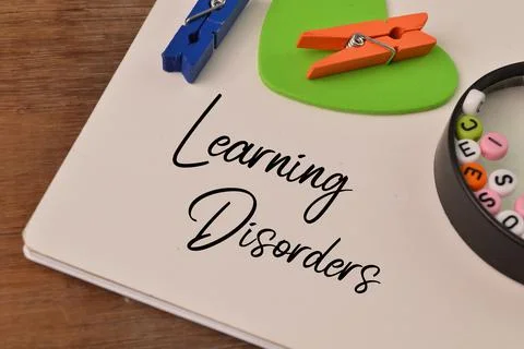 Top view of notebook written with text LEARNING DISORDERS Stock Photos