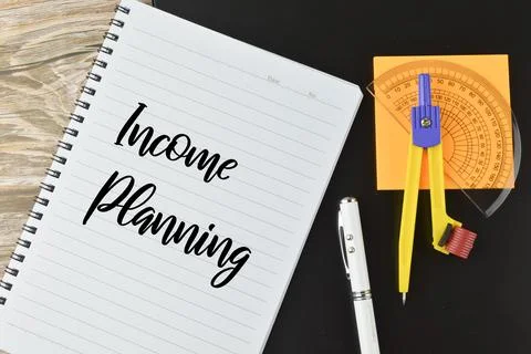 Top view of notebook written with text INCOME PLANNING. Business concept. Stock Photos