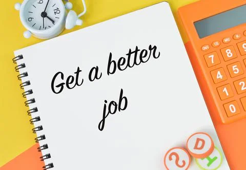 Top view of notebook written with text GET A BETTER JOB. Foto stock