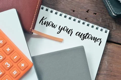 Top view of notebooks written with text KNOW YOUR CUSTOMER. Stock Photos