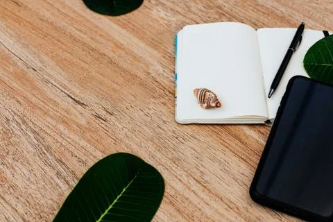 Top view of a notepad with white paper and pen for planning freelancer plan Stock Photos