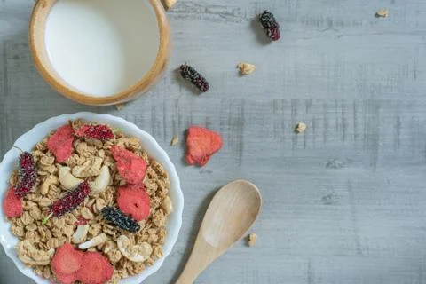 Top view of oat flakes with strawberry, mulberry, almond and milk Stock Photos