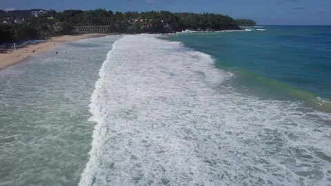Top view of the ocean with waves and the beach Video stock 245840500