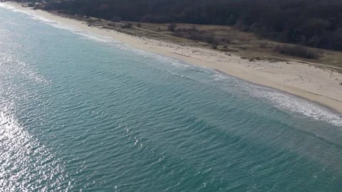 Top view of ocean waves meeting sandy coast Stock Footage 328571841