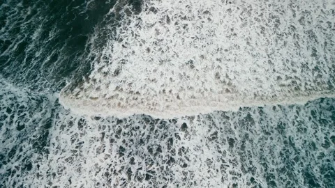 Top View Ocean waves on a sandy beach with white foam in the Atlantic ocean Stock Footage 261985241