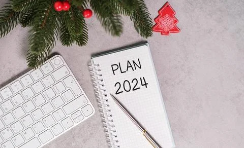 Top view of the office desk. Notepad and lettering plan for 2024. Plans and.. Stock Photos