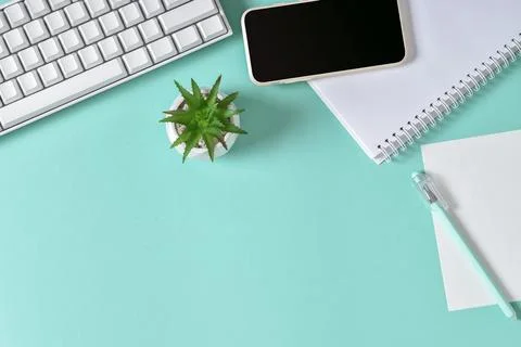 Top view of the office desk. Working atmosphere . Keyboard, smartphone and no Stock Photos