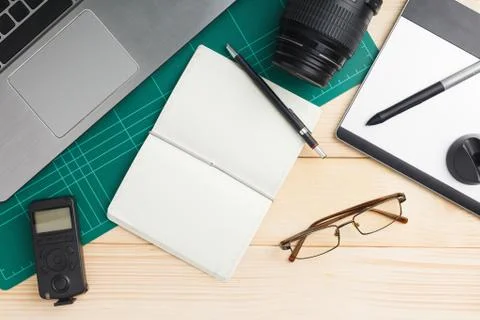 Top view of office stuff and gadgets on wooden desk Stock Photos