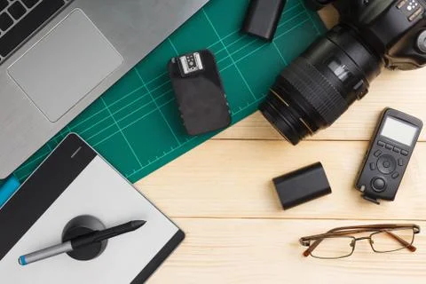 Top view of office stuff and gadgets on wooden desk Stock Photos