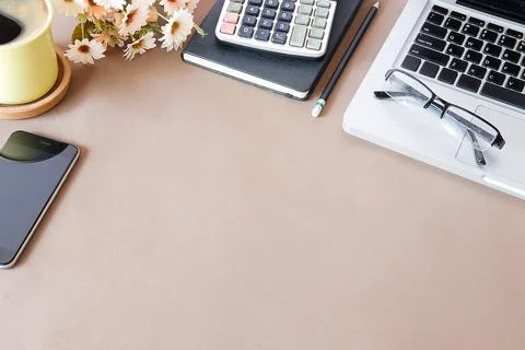 Top view office stuff with notepad, laptop and coffee cup mouse notepad shot. Stock Photos