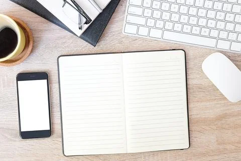 Top view office stuff with notepad, laptop and coffee cup mouse notepad shot. Stock Photos