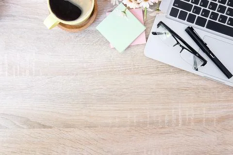 Top view office stuff with notepad, laptop and coffee cup mouse notepad shot. Stock Photos