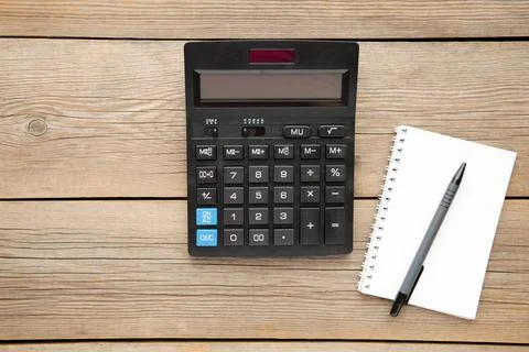 Top view office table calculator with pen and notebook on the table for busin Stock Photos