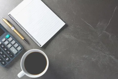 Top view office table with paper and coffee and calculator and pen for busine Foto stock
