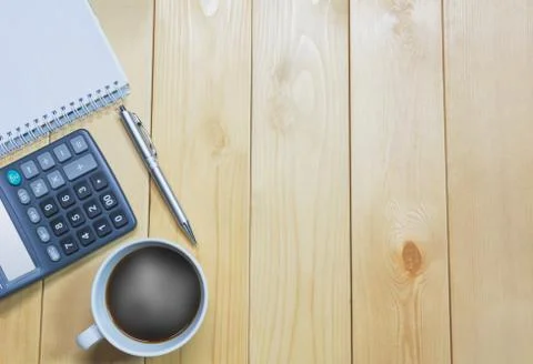 Top view office table with paper and coffee and calculator and pen for busine Stock Photos