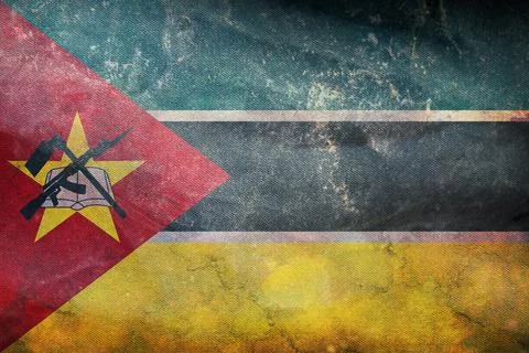 Top view of official retro flag Mozambique with grunge texture. travel and pa Illustrazione stock