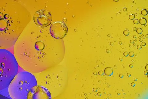 Top view oil bubbles drop on the water with colorful background, Macro phot.. Stock Photos