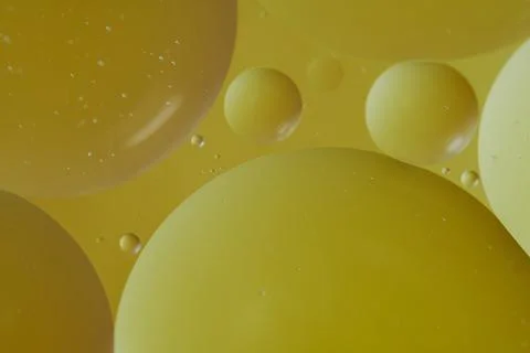 Top view oil bubbles drop on the water with colorful background, Macro phot.. Stock Photos