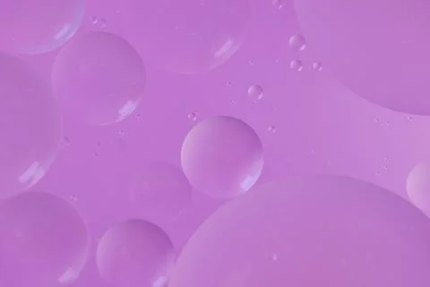 Top view oil bubbles drop on the water with colorful background, Macro phot.. Stock Photos