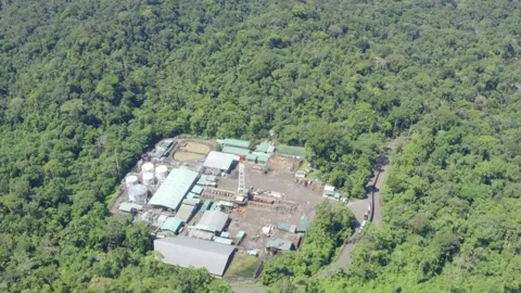 Top view of an oil pumping platform in an oil field of the Amazon rainforest Stock Footage 144418650